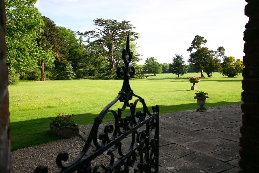 Lovely country house garden looking over a ha-ha at the surrounding countryside, within about 1 hour of Central London and easily accessible by the M4 or M40