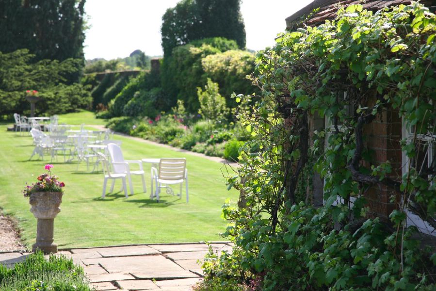 York stone patio along the front of a pretty country house