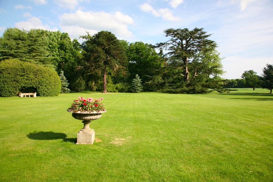 Lovely country house garden looking over a ha-ha at the surrounding countryside, within about 1 hour of Central London and easily accessible by the M4 or M40