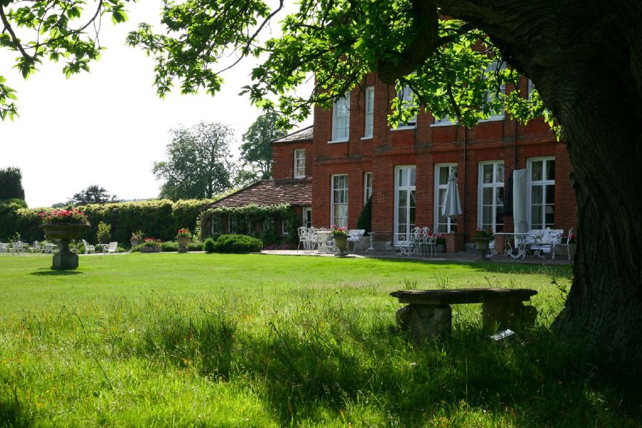 Lovely country house garden looking over a ha-ha at the surrounding countryside, within about 1 hour of Central London and easily accessible by the M4 or M40