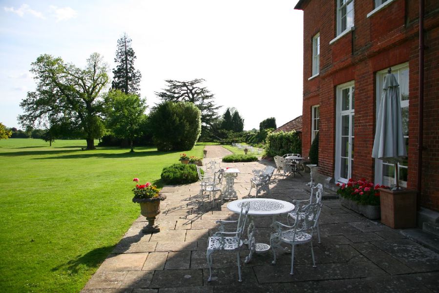 Lovely country house garden looking over a ha-ha at the surrounding countryside, within about 1 hour of Central London and easily accessible by the M4 or M40
