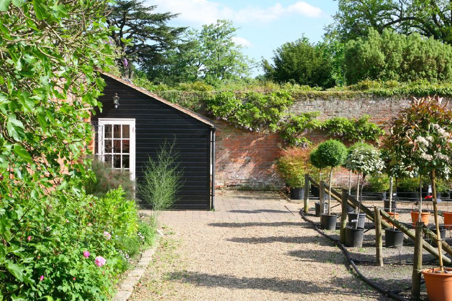 Lovely country house garden looking over a ha-ha at the surrounding countryside, within about 1 hour of Central London and easily accessible by the M4 or M40