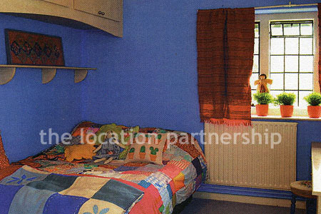 A very large country style house with three reception rooms, eight bedrooms and 1.2 acres of south facing garden