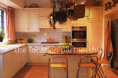 A very large country style house with three reception rooms, eight bedrooms and 1.2 acres of south facing garden