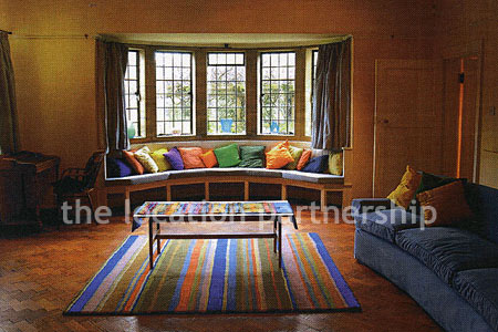 A very large country style house with three reception rooms, eight bedrooms and 1.2 acres of south facing garden