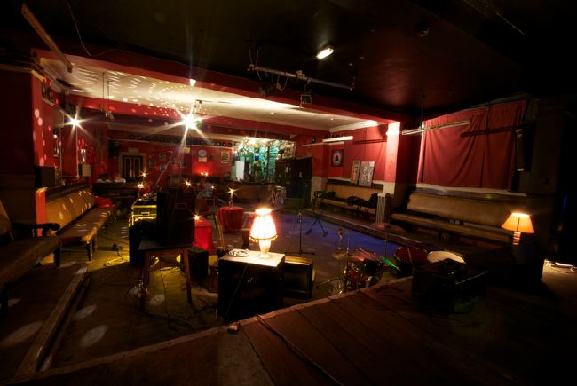 Semi derelict Victorian Gothic Mansion with a real urban edge. It has a functioning recording studio and gallery space.