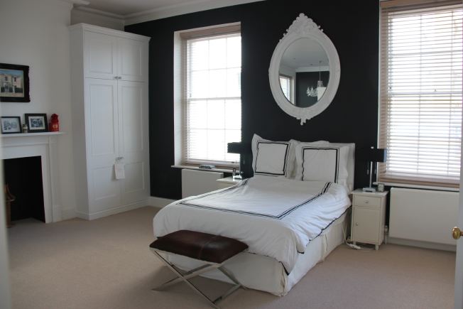 Lovely spacious bedroom of modernised Georgian house with ensuite bathroom and roll top bath. NB- stills and smaller shoots preferred.