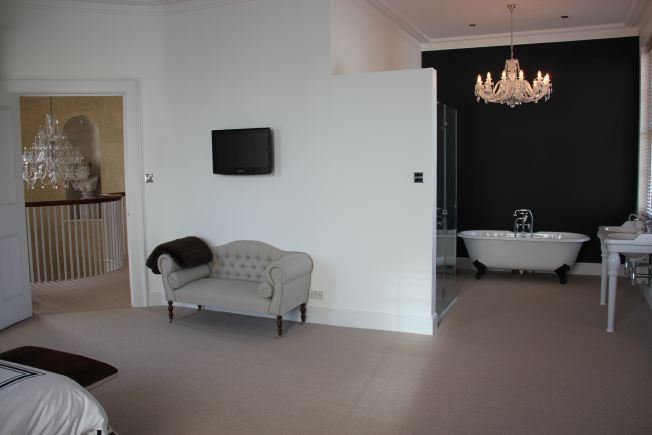 Lovely spacious bedroom of modernised Georgian house with ensuite bathroom and roll top bath. NB- stills and smaller shoots preferred.