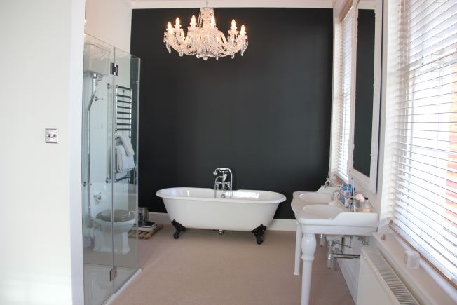 Lovely spacious bedroom of modernised Georgian house with ensuite bathroom and roll top bath. NB- stills and smaller shoots preferred.
