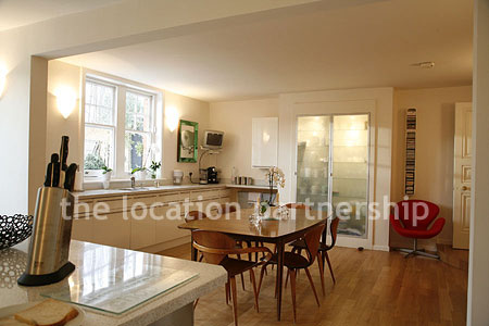 Spacious modern kitchen with island in large ground floor flat.