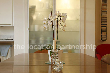 Spacious modern kitchen with island in large ground floor flat.