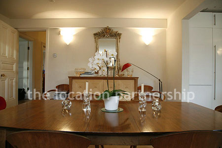 Spacious modern kitchen with island in large ground floor flat.
