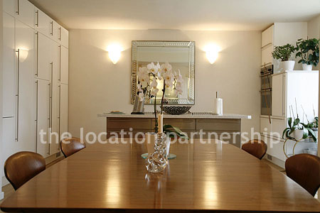 Spacious modern kitchen with island in large ground floor flat.