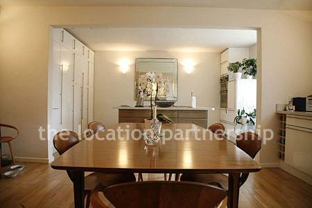 Spacious modern kitchen with island in large ground floor flat.