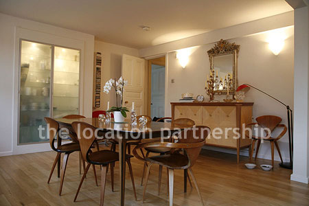 Spacious modern kitchen with island in large ground floor flat.