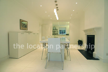 A bright, modern kitchen within a large Victorian property.