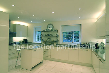 A bright, modern kitchen within a large Victorian property.