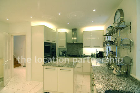 A bright, modern kitchen within a large Victorian property.