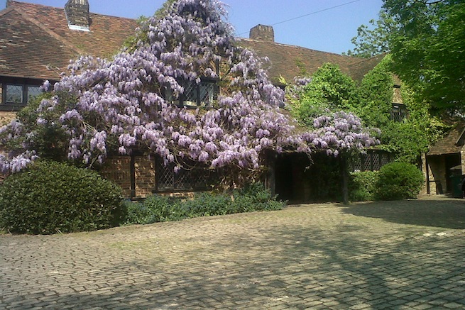 Large architect designed family home with original floor to ceiling log fireplace and 16th century beams. Backs onto woodland.