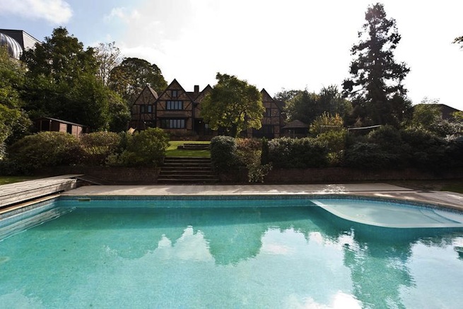 Large architect designed family home with original floor to ceiling log fireplace and 16th century beams. Backs onto woodland.