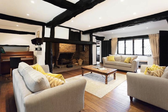 Large architect designed family home with original floor to ceiling log fireplace and 16th century beams. Backs onto woodland.
