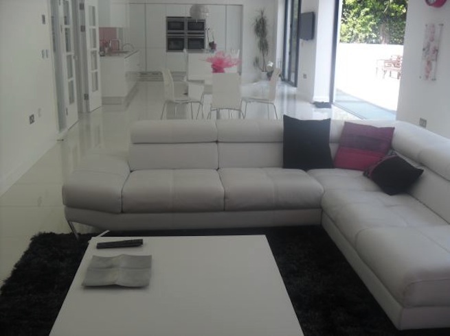 Sitting room in bright, modern family home.