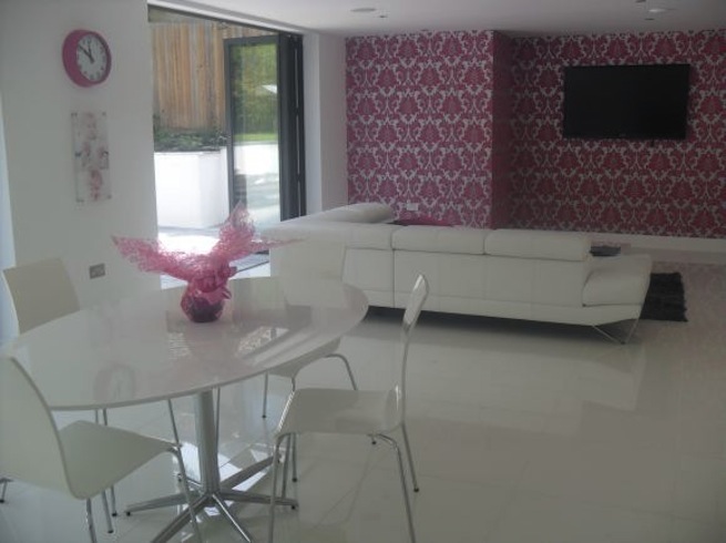 Sitting room in bright, modern family home.
