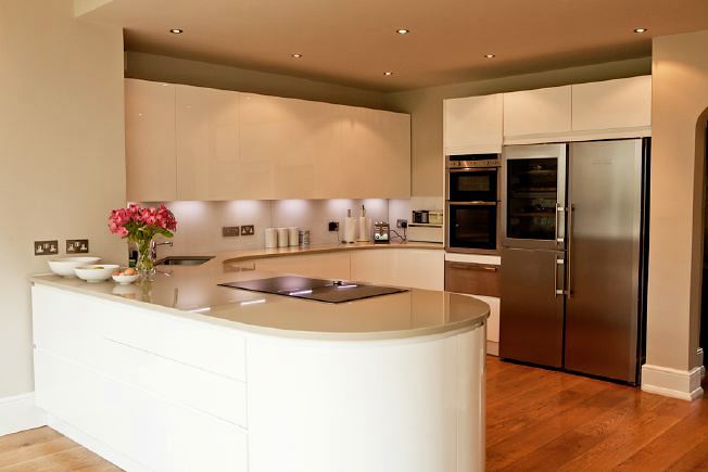 Lovely, light clean lined kitchen with bi-folding doors opening onto the garden.