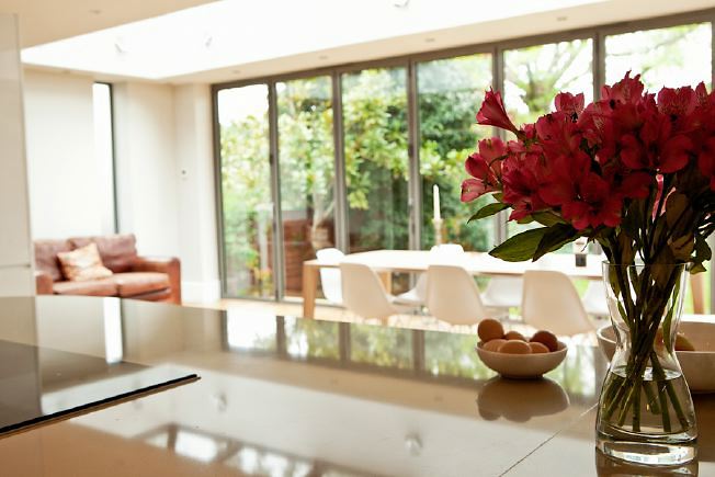 Lovely, light clean lined kitchen with bi-folding doors opening onto the garden.