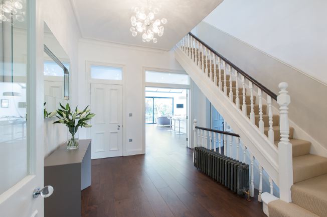 Wide entrance hall, stairs and landings in modernised Victorian house.