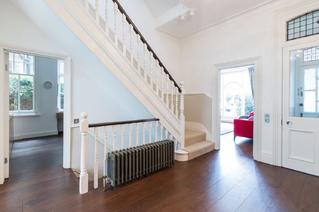 Wide entrance hall, stairs and landings in modernised Victorian house.