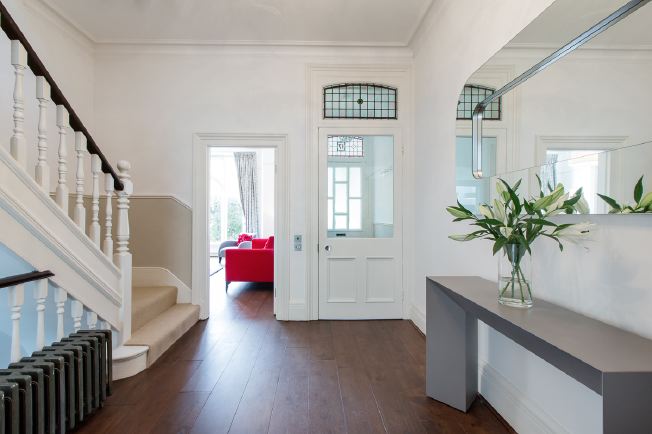 Wide entrance hall, stairs and landings in modernised Victorian house.