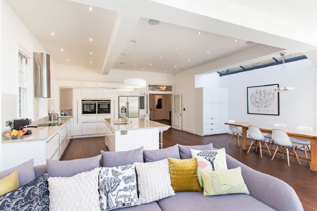 Light and airy, spacious kitchen approx 26ft x 24ft with an island, breakfast bar and big sliding doors to the rear garden.