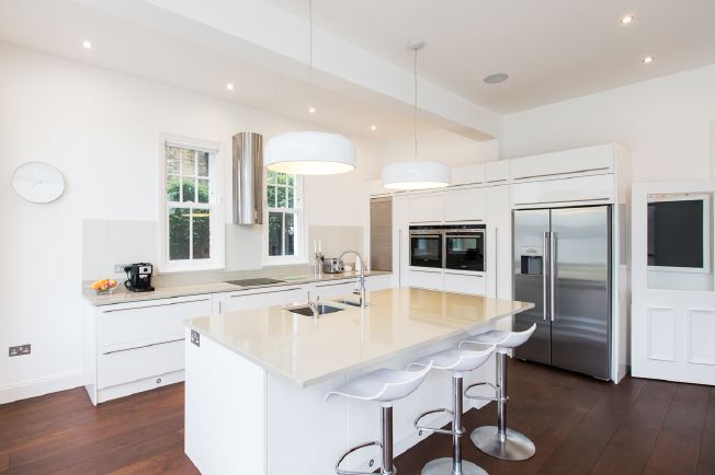 Light and airy, spacious kitchen approx 26ft x 24ft with an island, breakfast bar and big sliding doors to the rear garden.