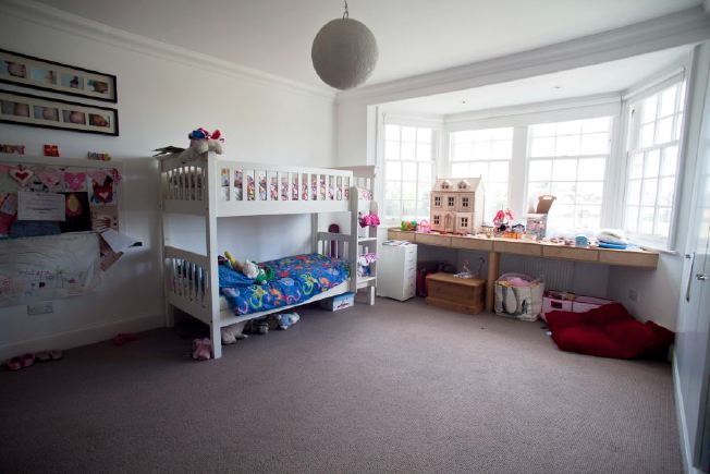 Spacious children's bedrooms in family house.