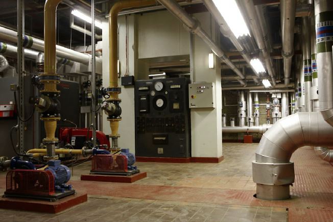 Subterranean network of corridors, tunnels and rooms with industrial pipes and features.