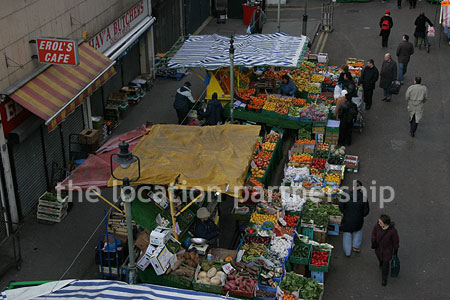 Vibrant street market seen from overhead bridge