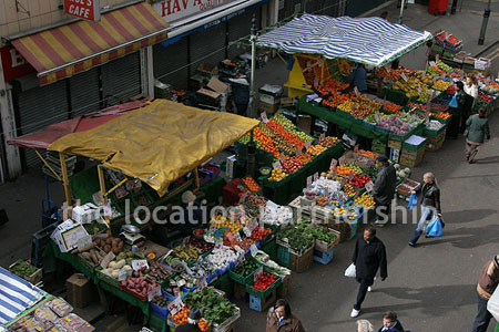 Vibrant street market seen from overhead bridge
