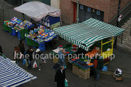 Vibrant street market seen from overhead bridge