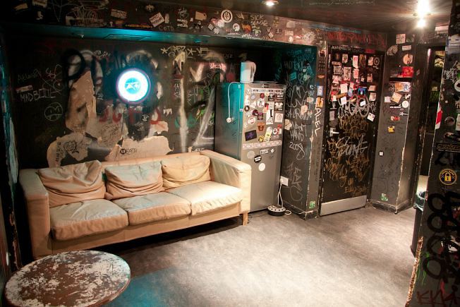 Underground music venue and backstage areas.