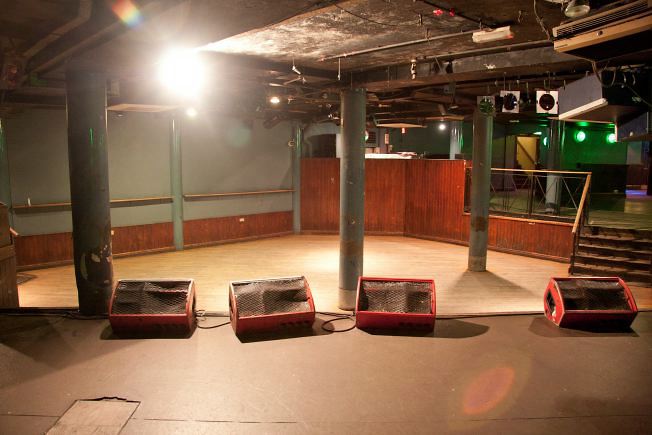 Underground music venue and backstage areas.