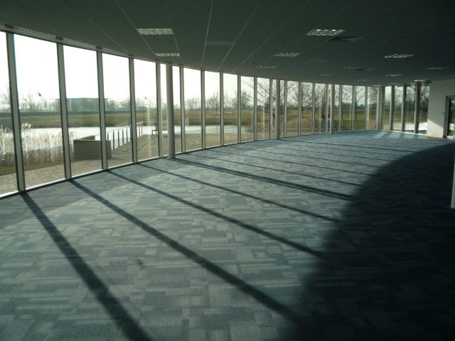 Contemporary, well situated office building overlooking a boardwalk and lake.