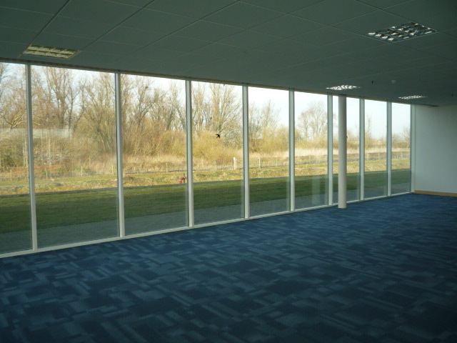 Contemporary, well situated office building overlooking a boardwalk and lake.