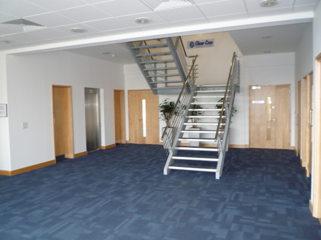 Contemporary, well situated office building overlooking a boardwalk and lake.