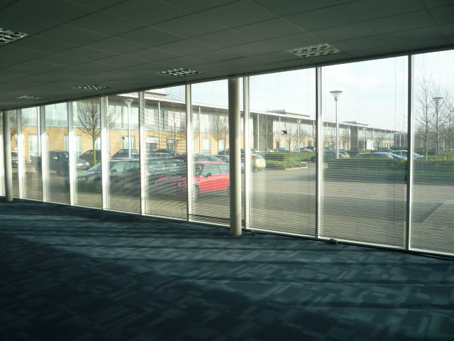 Contemporary, well situated office building overlooking a boardwalk and lake.