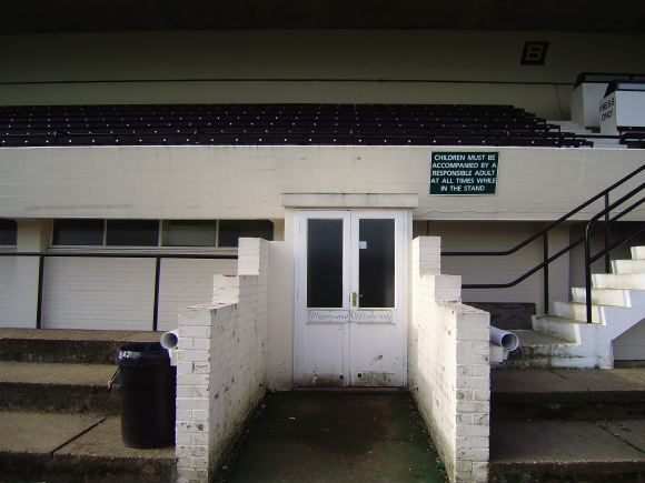 Sports Club with rugby pitches, clubhouse, turnstiles, canteen and members' bar.