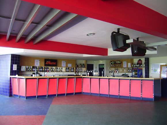 Sports Club with rugby pitches, clubhouse, turnstiles, canteen and members' bar.
