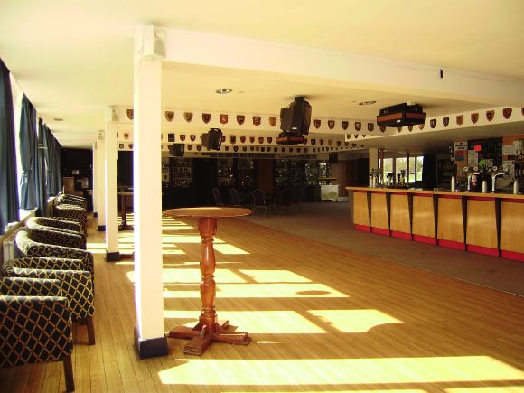 Sports Club with rugby pitches, clubhouse, turnstiles, canteen and members' bar.
