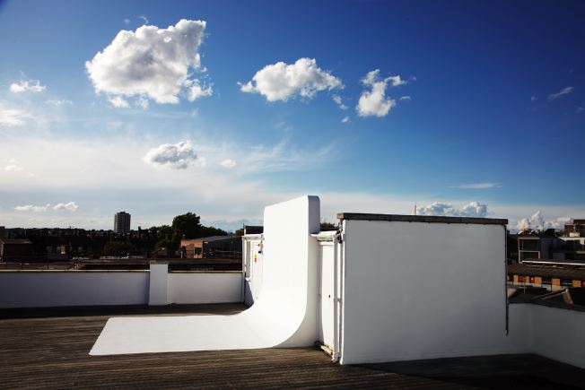 Decked roof terrace with infinity cove. Providing magnificent views across East London.