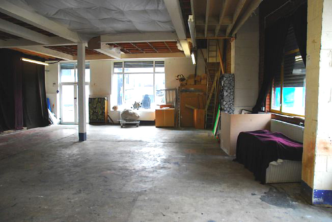 Bright, spacious 1,200 sq ft warehouse conversion with living area and studio space. The studio space is glass fronted with shutters and can be blacked out. NB- ceiling is now solid - no beams.